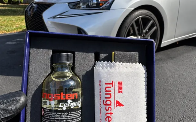 A Tungsten ceramic coating kit next to the freshly coated car