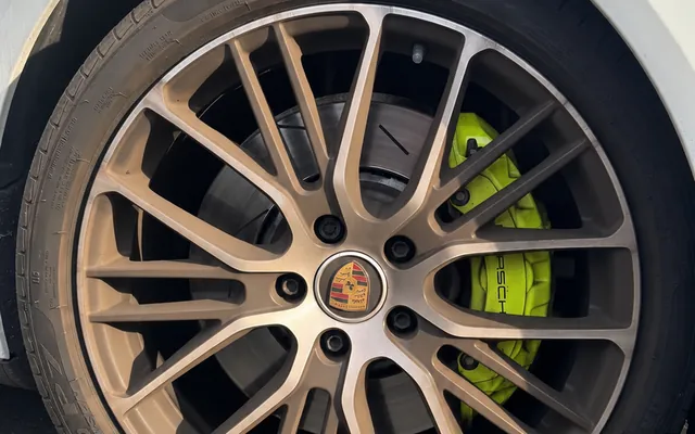 Porsche wheel before, buried under brake dust and embedded iron