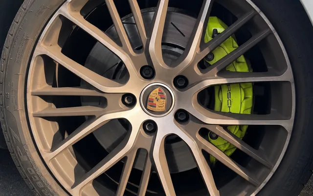 Porsche wheel before, buried under brake dust and embedded iron